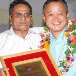 Prof. Bal Krishna Pokhrel felicitating Nawa Raj Subba.